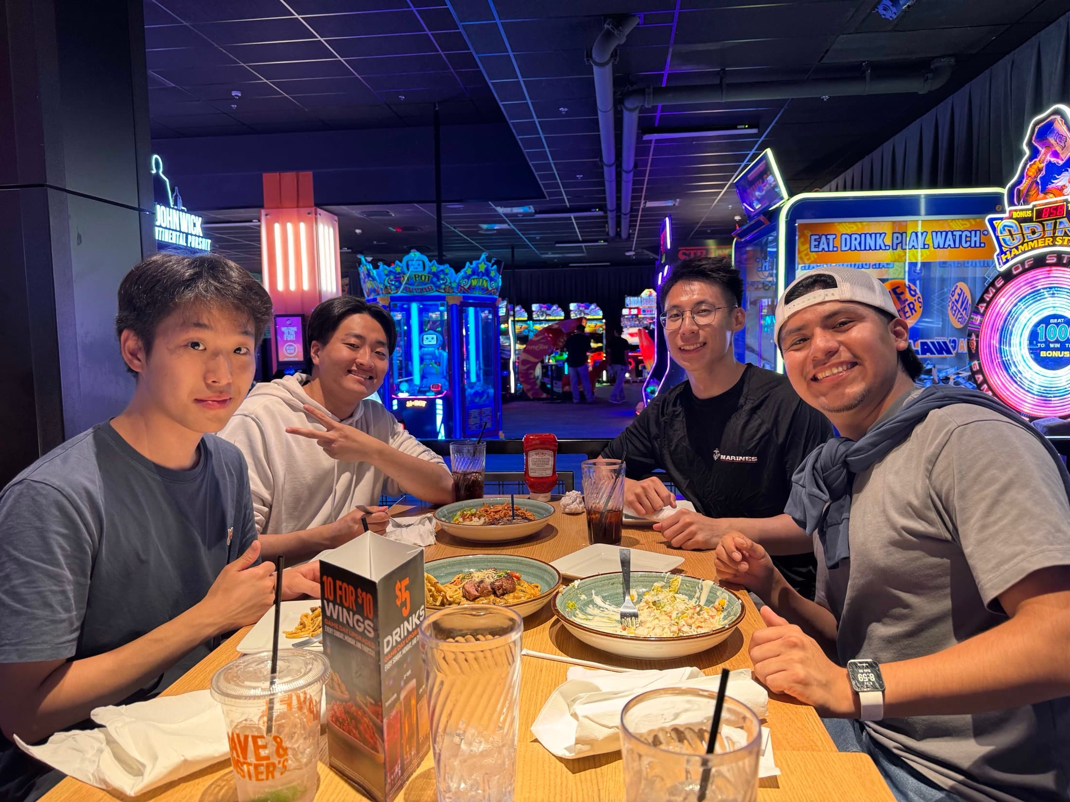 Four chapter members gathered around a restaurant table