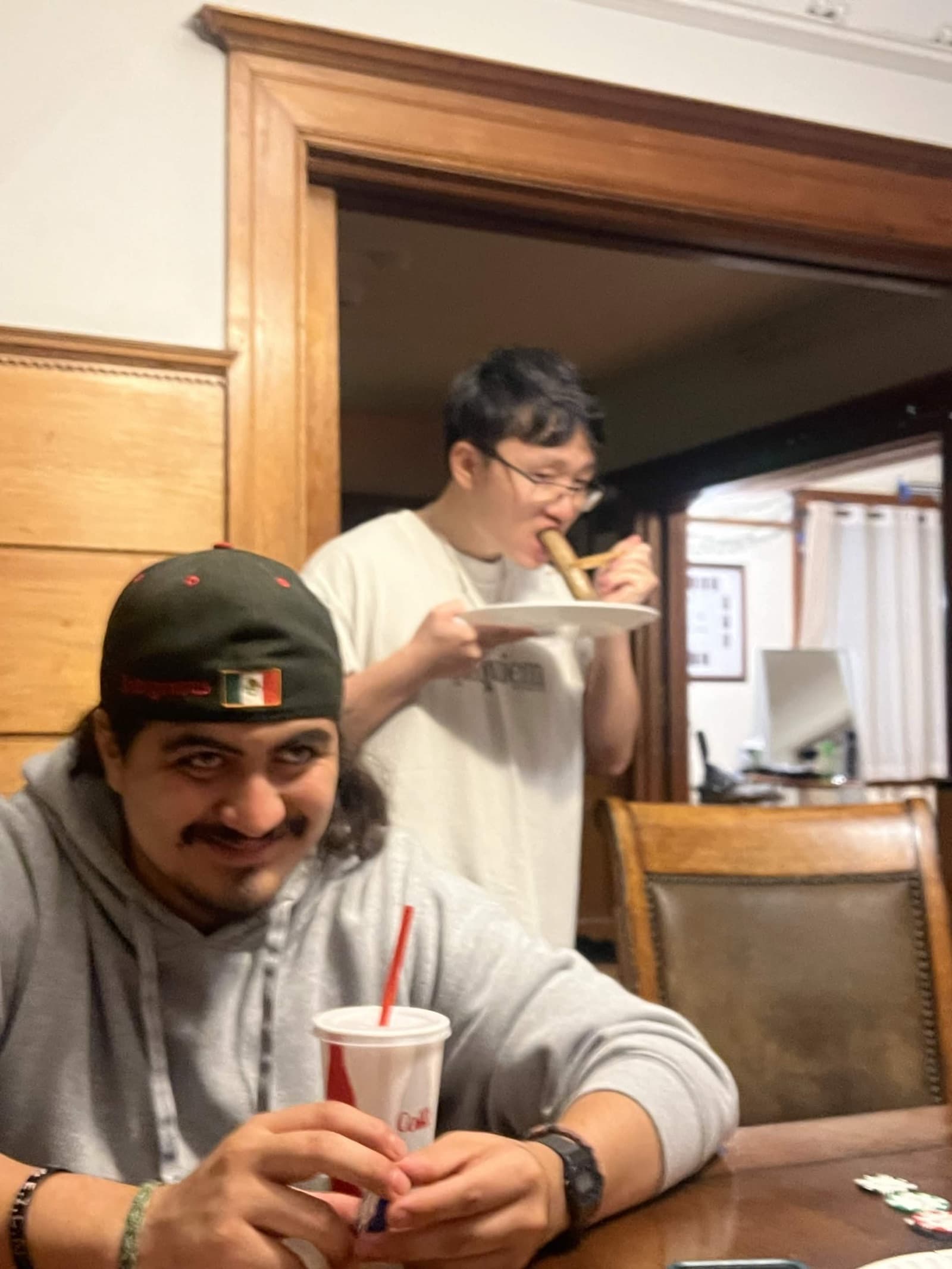 Two chapter members sharing a meal at the chapter house